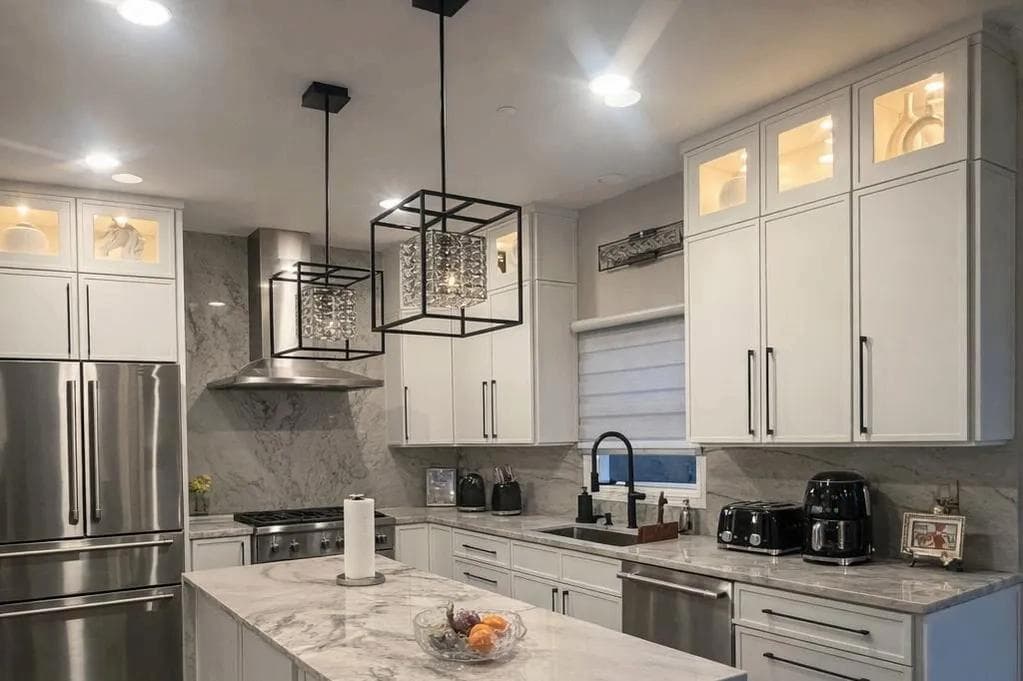 Close-up view of Slim Shaker Dove White cabinets with modern hardware in a Humboldt Park kitchen renovation
