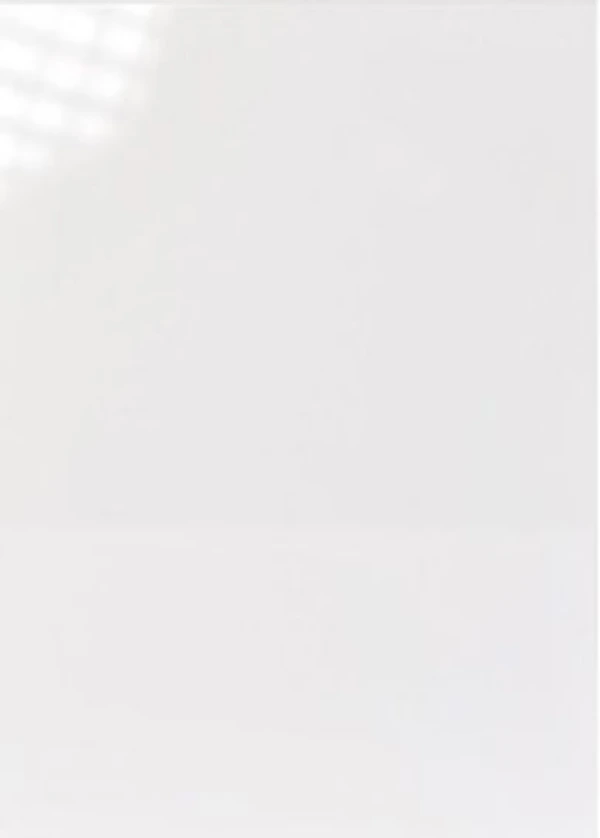 High-gloss white cabinet door with a smooth reflective finish for modern kitchen designs