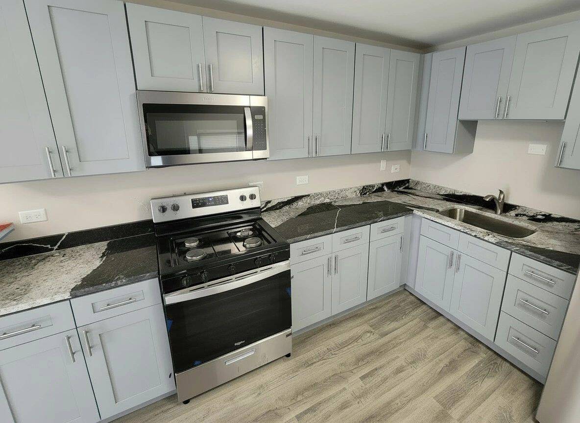 Gray shaker kitchen cabinets installed in a Chicago project
