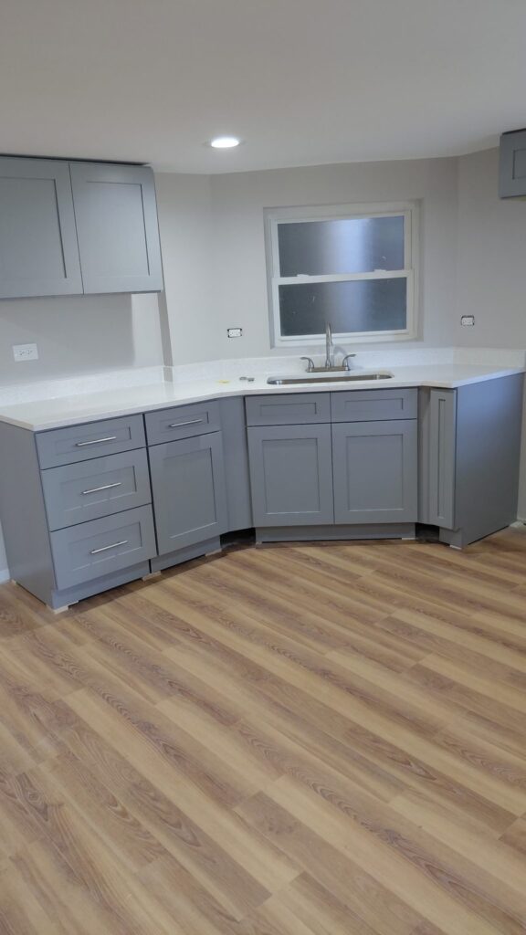 Sink wall with gray shaker cabinets and white quartz countertop, Humboldt Park, Chicago kitchen