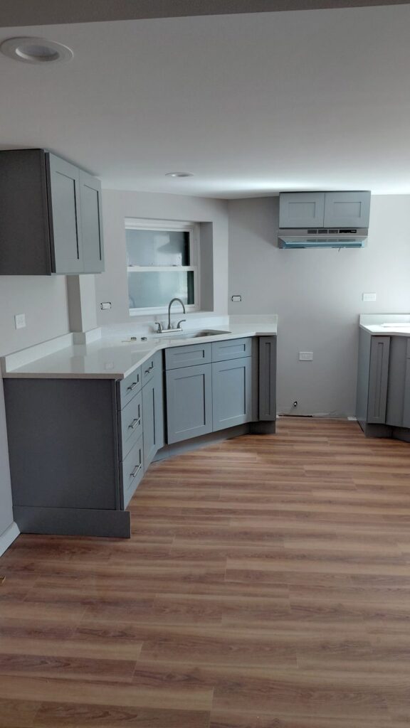 Gray shaker sink run with white quartz countertop and wall cabinets, Humboldt Park, Chicago